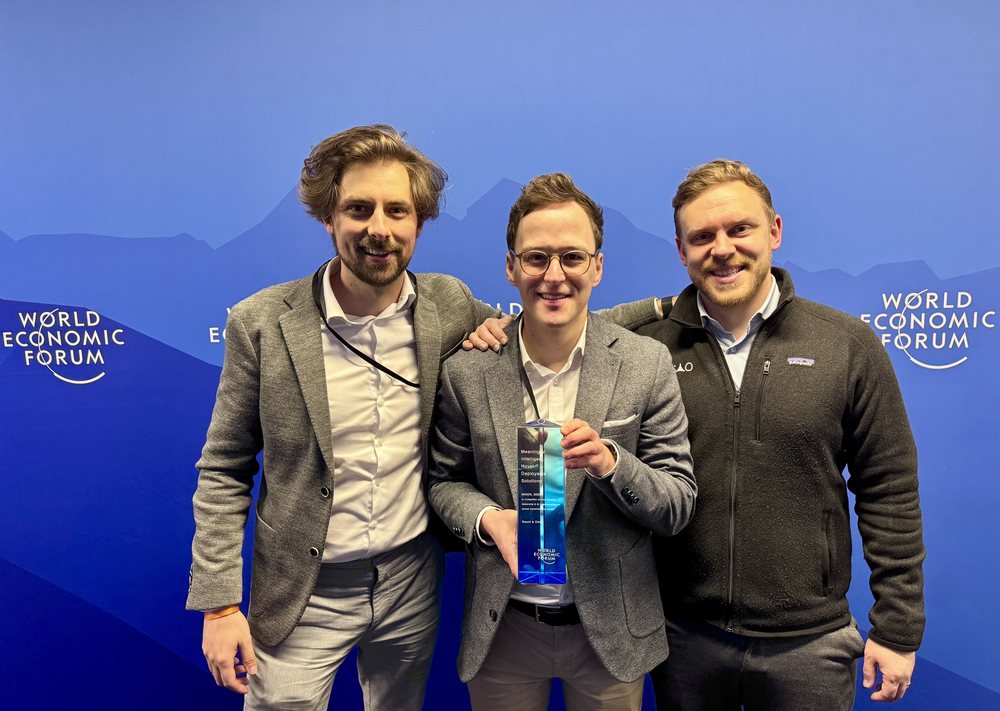 OAO's founders with the award at the World Economic Forum in Davos